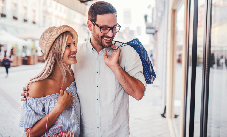 Shopping time. Young couple in shopping. Consumerism, love, dating, lifestyle concept